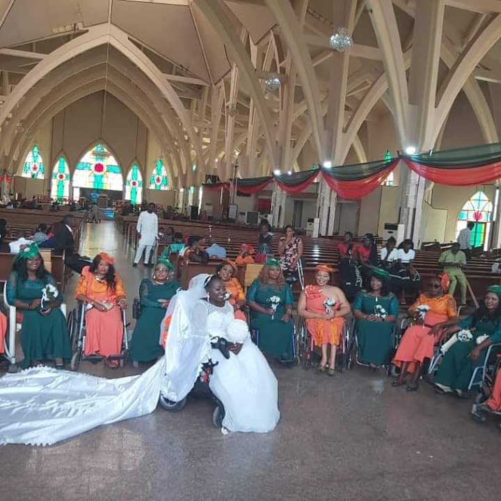 Physically challenged Nigerian lady weds her husband in Abuja with a bridal train of ladies on wheelchairs (photos)