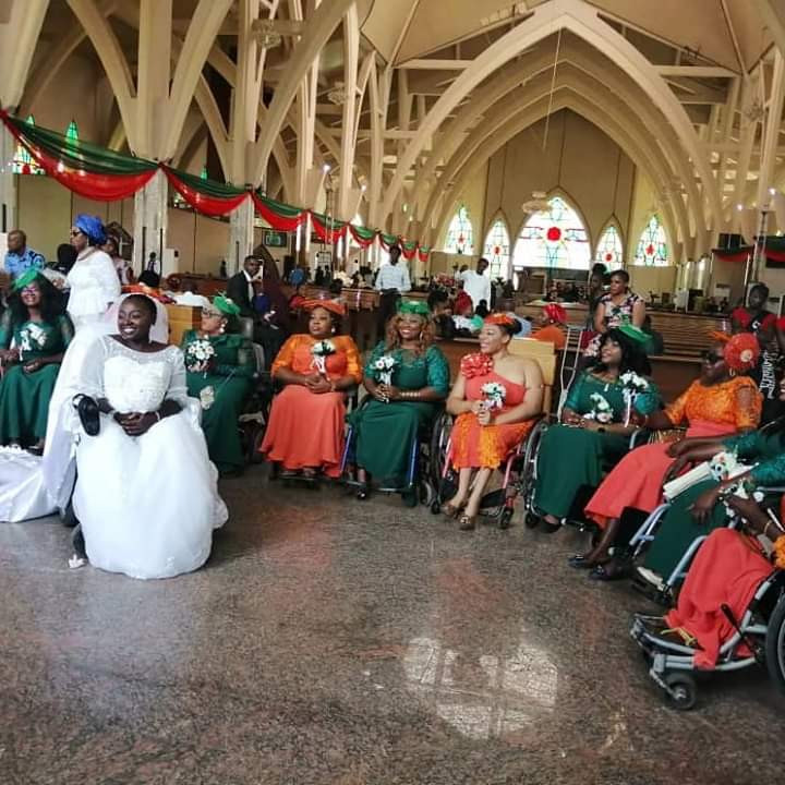 Physically challenged Nigerian lady weds her husband in Abuja with a bridal train of ladies on wheelchairs (photos)