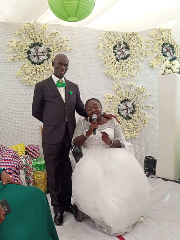 Physically challenged Nigerian lady weds her husband in Abuja with a bridal train of ladies on wheelchairs (photos)
