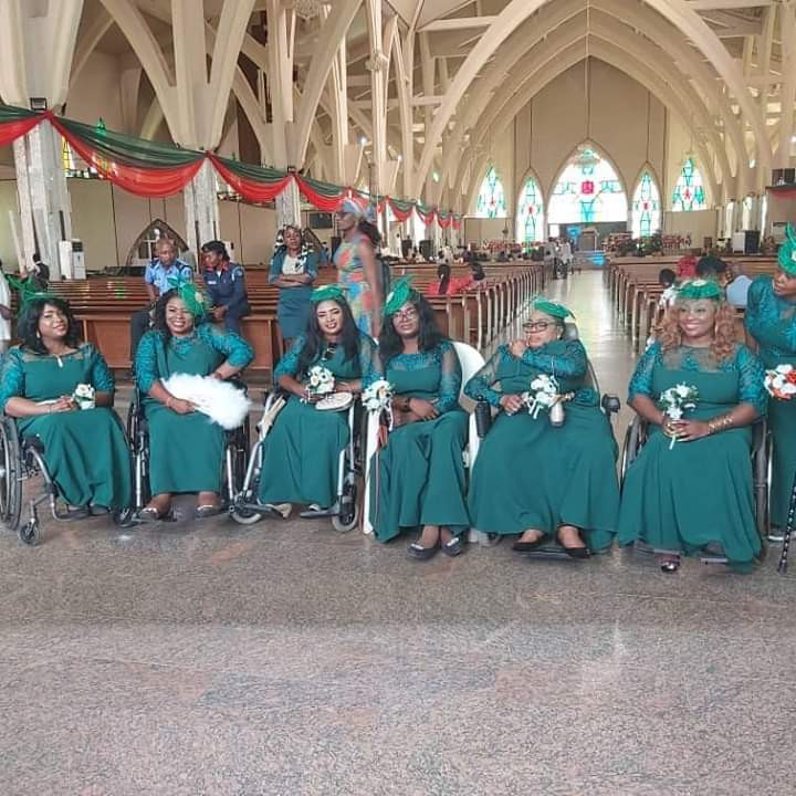 Physically challenged Nigerian lady weds her husband in Abuja with a bridal train of ladies on wheelchairs (photos)