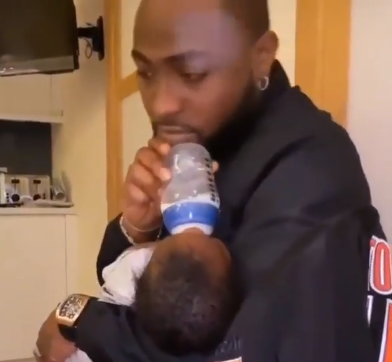 Adorable video of Davido feeding his son, David Jnr