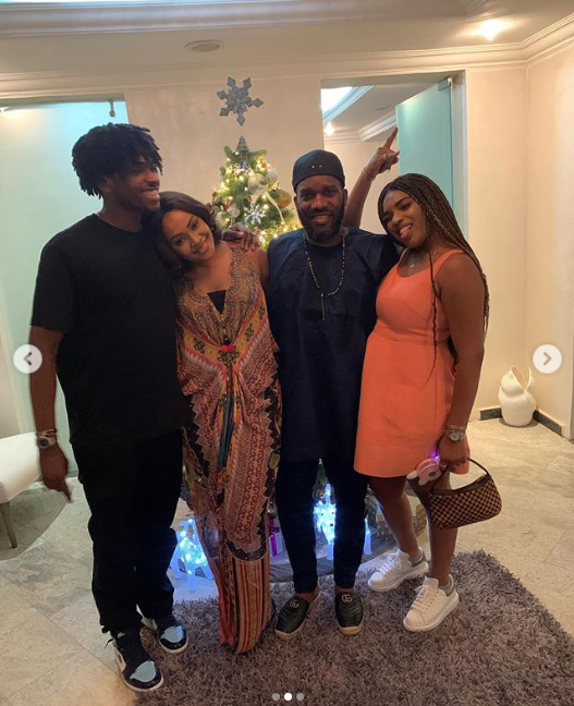 Nigerian football legend Jay-Jay Okocha poses with his wife and children for New Year