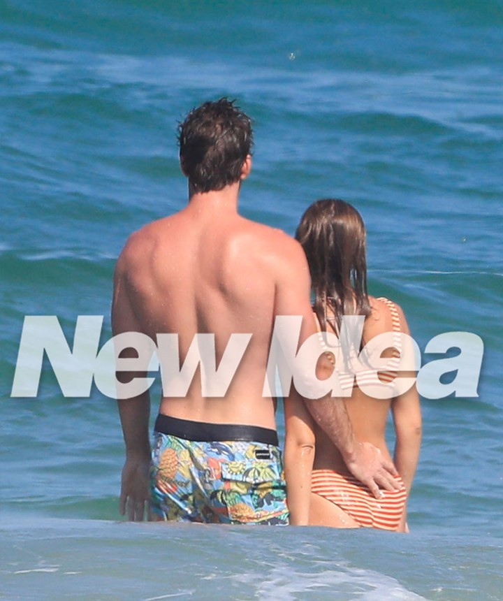 Liam Hemsworth confirms romance with model Gabriella Brooks as they kiss on the beach