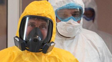 Putin in protective suit on 24 March