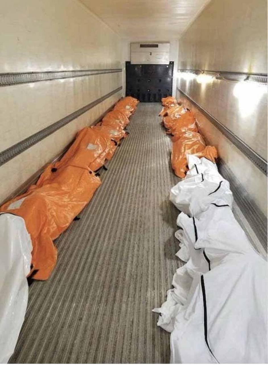 Dead bodies loaded into refrigerated trucks outside New York hospitals after 98 people die from coronavirus in seven hours (video)