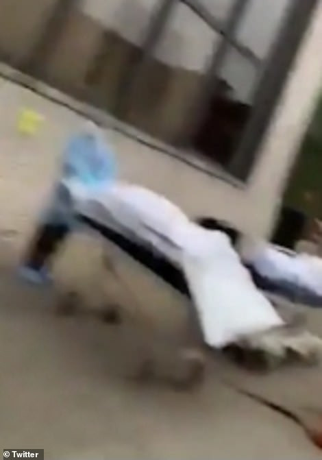 Dead bodies loaded into refrigerated trucks outside New York hospitals after 98 people die from coronavirus in seven hours (video)