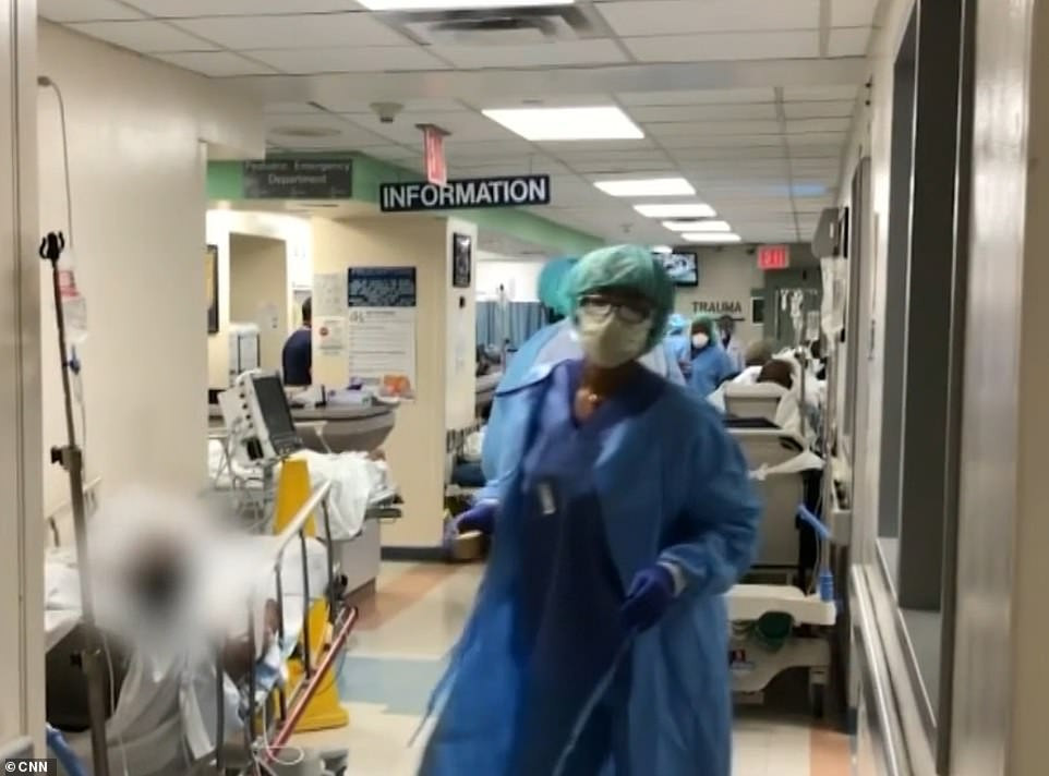 Dead bodies loaded into refrigerated trucks outside New York hospitals after 98 people die from coronavirus in seven hours (video)