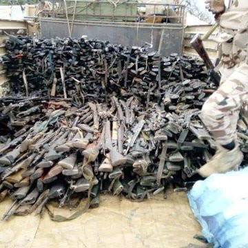 Nigerian soldiers spotted hailing soldiers from Chad as their President lead them to war against Boko Haram, see stash of arms recovered (videos/photos)