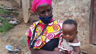 Peninah Bahati Kitsao and one of her children in Mombasa, Kenya