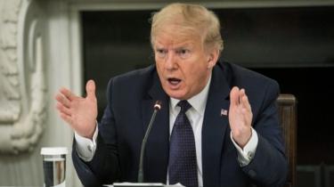 President Donald Trump speaks during a roundtable in the State Dining Room of the White House May 18