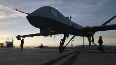 Maintenance personnel check a Predator drone operated by U.S. Office of Air and Marine