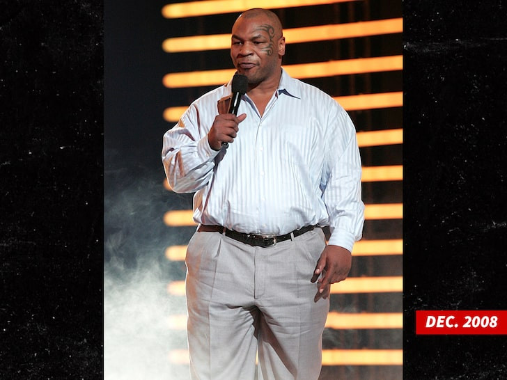 53 year old Mike Tyson shows off toned physique and abs while throwing punches as he prepares for boxing comeback (Photos/video)