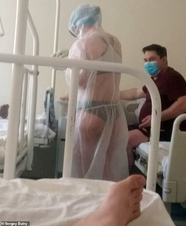 Politicians defend Nurse who wore only underwear under see-through PPE gown in male hospital ward as new image emerges