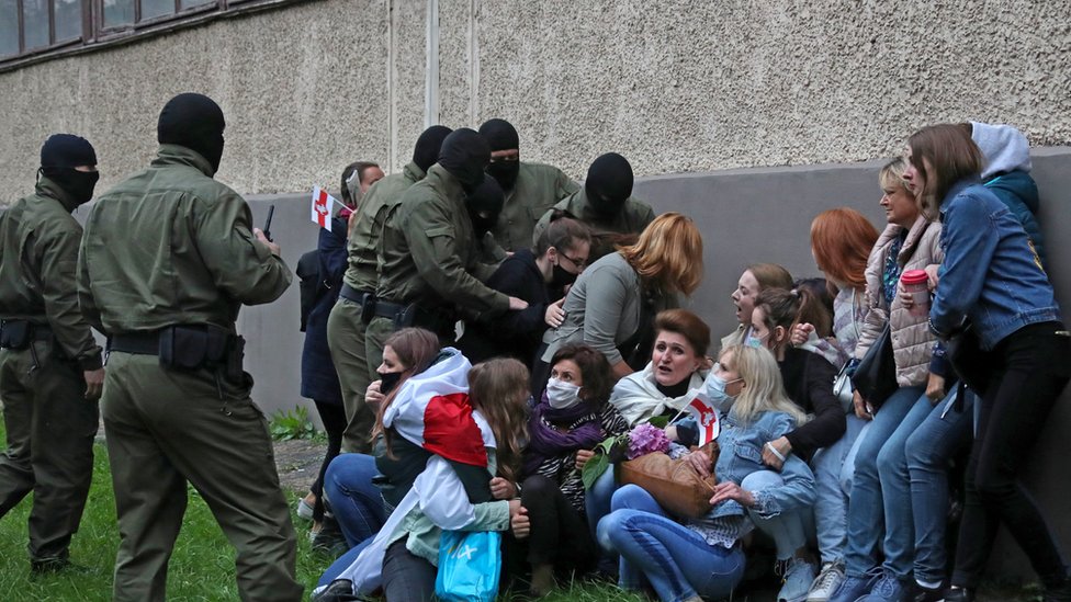 Women are detained during a march in support of Maria Kolesnikova and other opposition leaders
