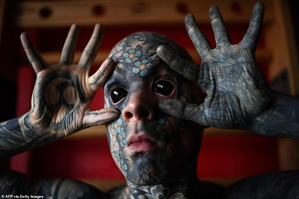 French primary school teacher who spent ?35k covering his body in tattoos is banned from kindergarten because he gives children nightmares (photos)