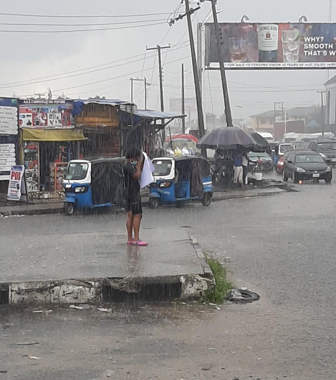 Woman stages lone end SARS protest under the rain in Warri