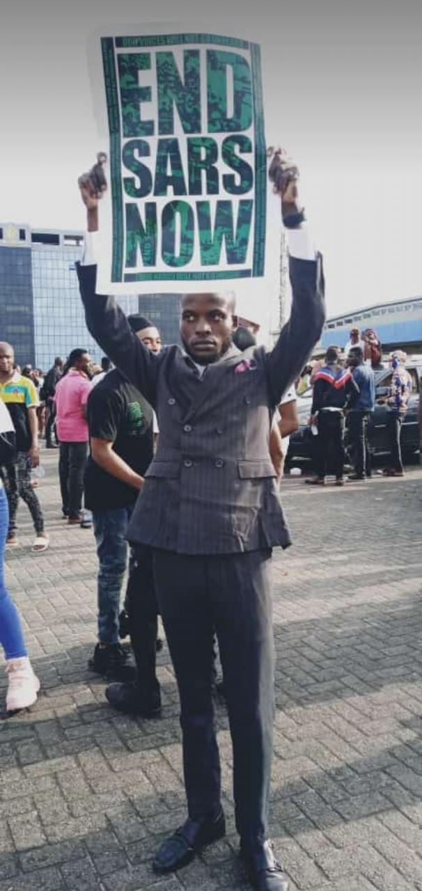 Photos of man who joined the #EndSARS protest in his wedding suit shortly after tying the knot