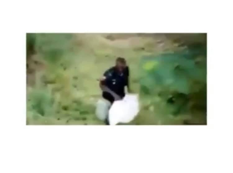 Policeman discreetly carts away