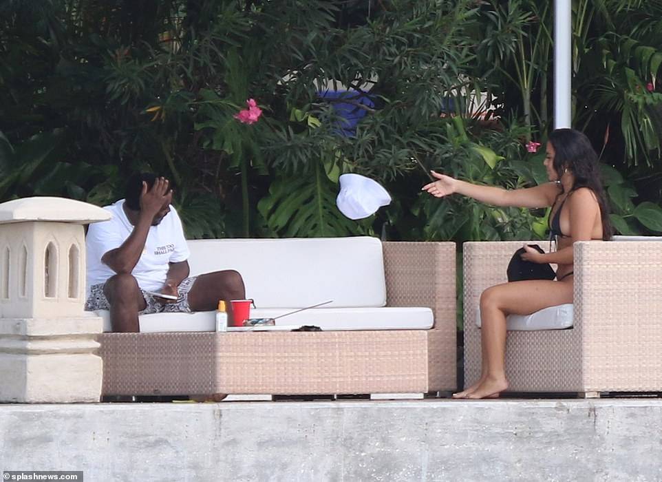 Hip-pop mogul, Diddy spotted with mystery woman at his Miami Beach mansion days after he was pictured kissing model Tina Louise (Photos)