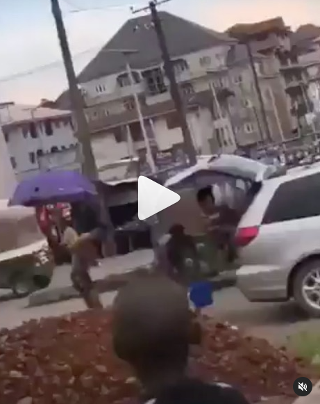 Suspected yahoo boys bath in the middle of the road as a native doctor performs ritual on them in Abia (video)