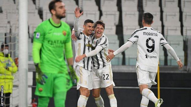 Cristiano Ronaldo (centre) celebrates his opening goal for Juventus against Roma