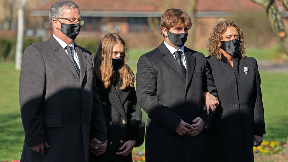 The family of Captain Sir Tom Moore (L-R) son-in-law Colin Ingram, granddaughter Georgia, grandson Benjie and daughter Hannah Ingram-Moore arrive funeral of Captain Sir Tom Moore at Bedford Crematorium
