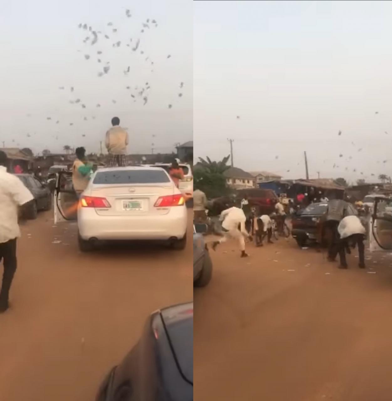 Alleged Yahoo Boys cause traffic as they stop in middle of the road to throw money in the air in Benin (video)