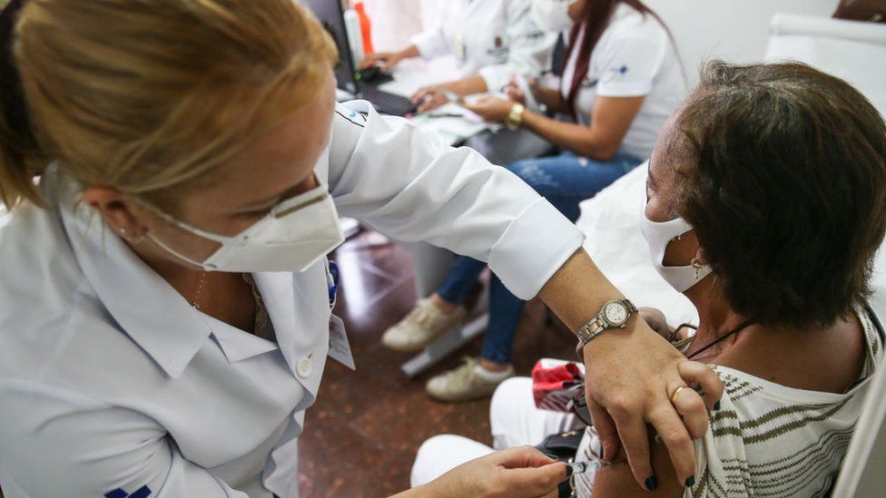 A senior citizen receives the vaccination shot on March 15, 2021 in Sao Paulo, Brazil
