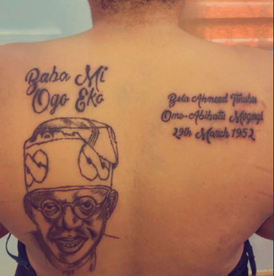 Lady tattoos Bola Tinubu