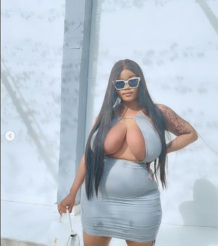 Endowed Instagram star, Ada La Pinky commands attention as she flaunts her massive boobs in revealing dress (photos)