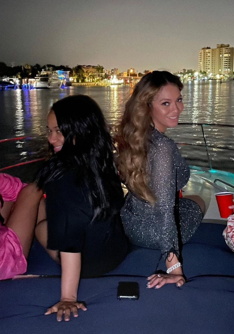 Beyonce flaunts curves in sheer gown with racy cut-outs and a plunging neckline as she lounges on a boat with close friends in Miami
