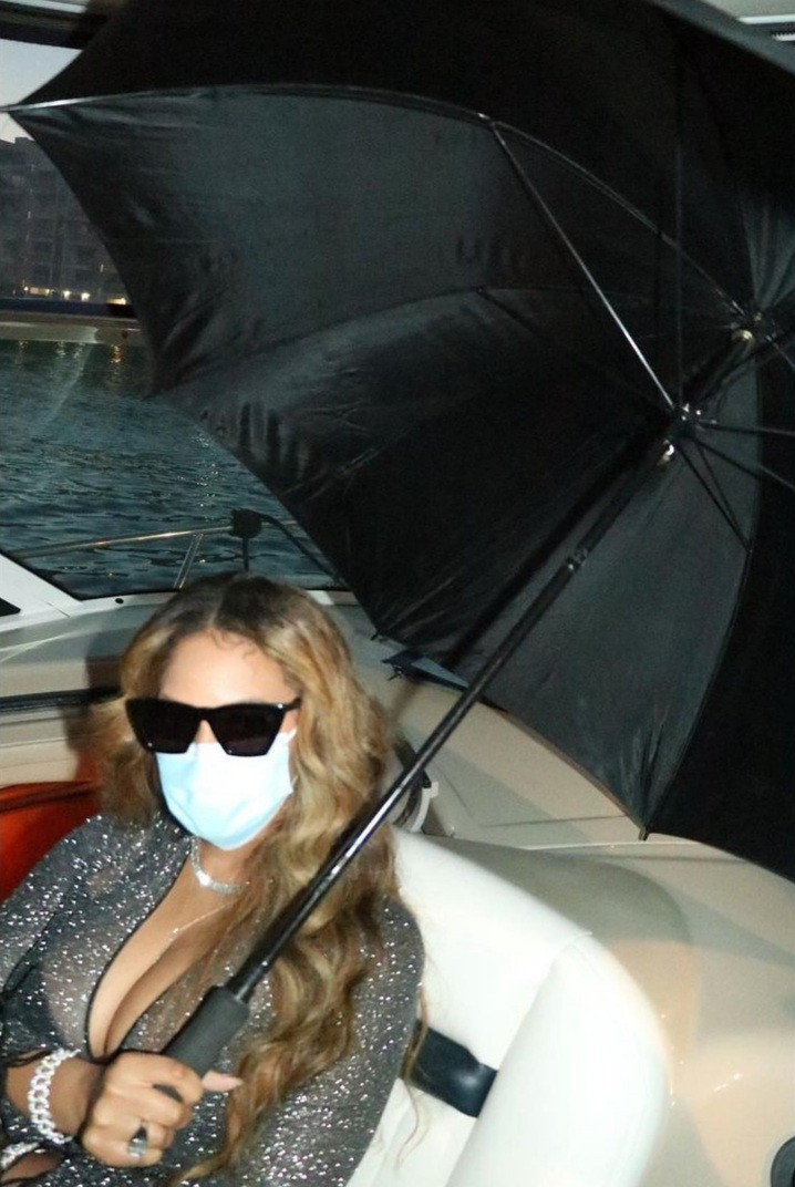 Beyonce flaunts curves in sheer gown with racy cut-outs and a plunging neckline as she lounges on a boat with close friends in Miami
