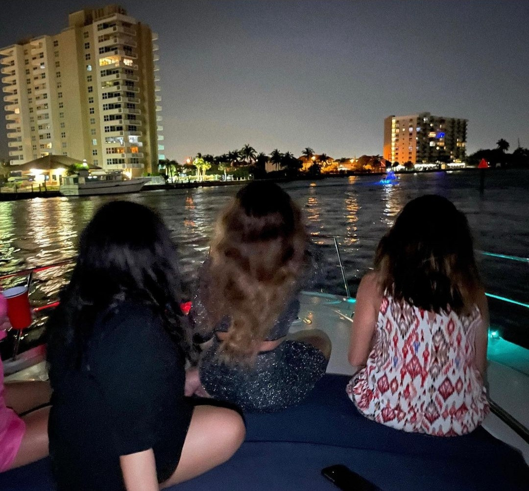 Beyonce flaunts curves in sheer gown with racy cut-outs and a plunging neckline as she lounges on a boat with close friends in Miami