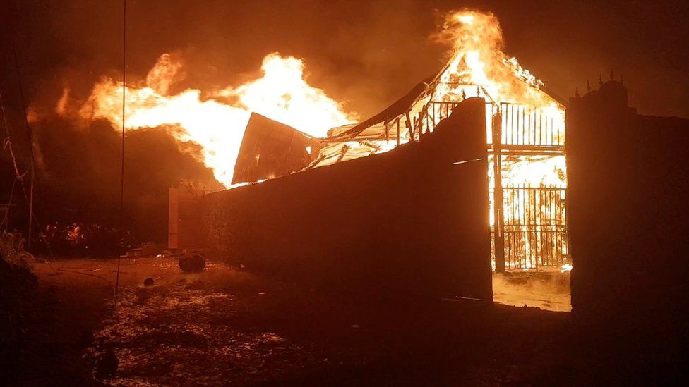 A building burns after the volcanic eruption of Mount Nyiragongo
