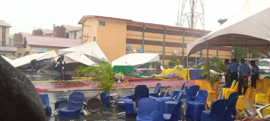 Officers and guests run for safety as heavy wind disrupts reception organized for IGP Baba