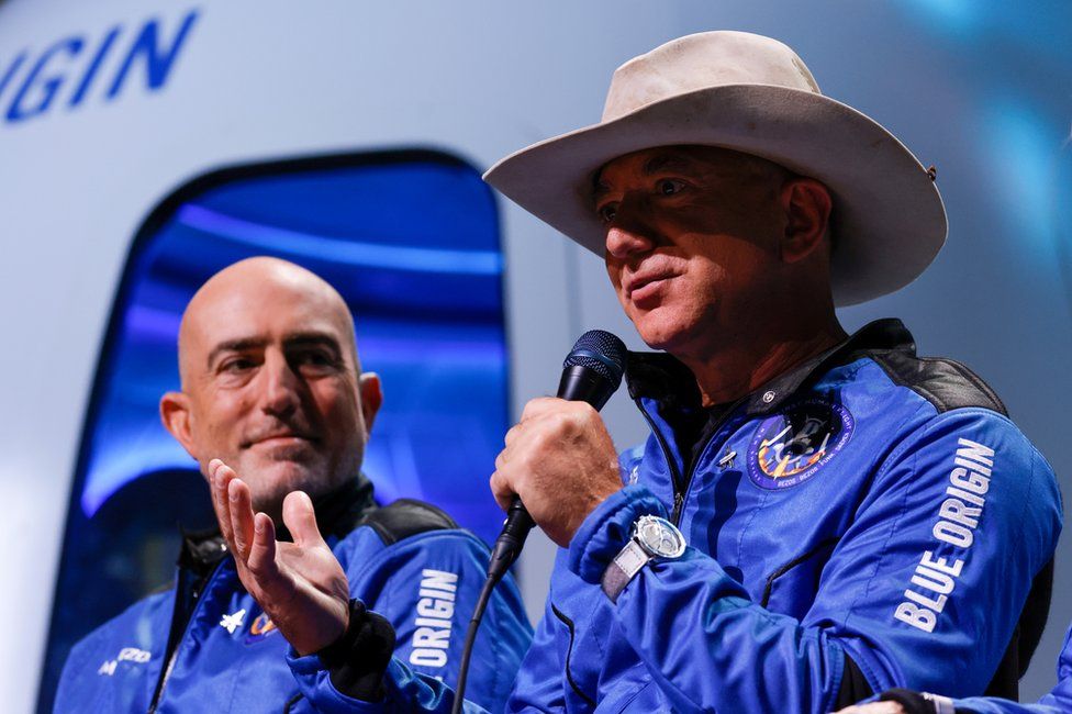 Mark Bezos (L) and Jeff Bezos