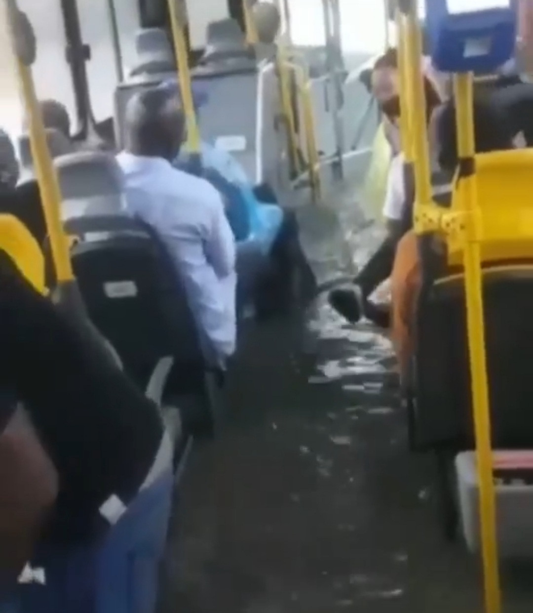 BRT bus floods with passengers in it following heavy downpour in Lagos (videos/photos)