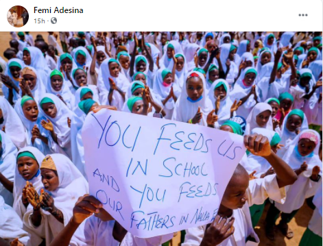 Femi Adesina shares photo of Katsina pupils carrying cardboard with grammatical blunders as they praised President Buhari for feeding them and their fathers