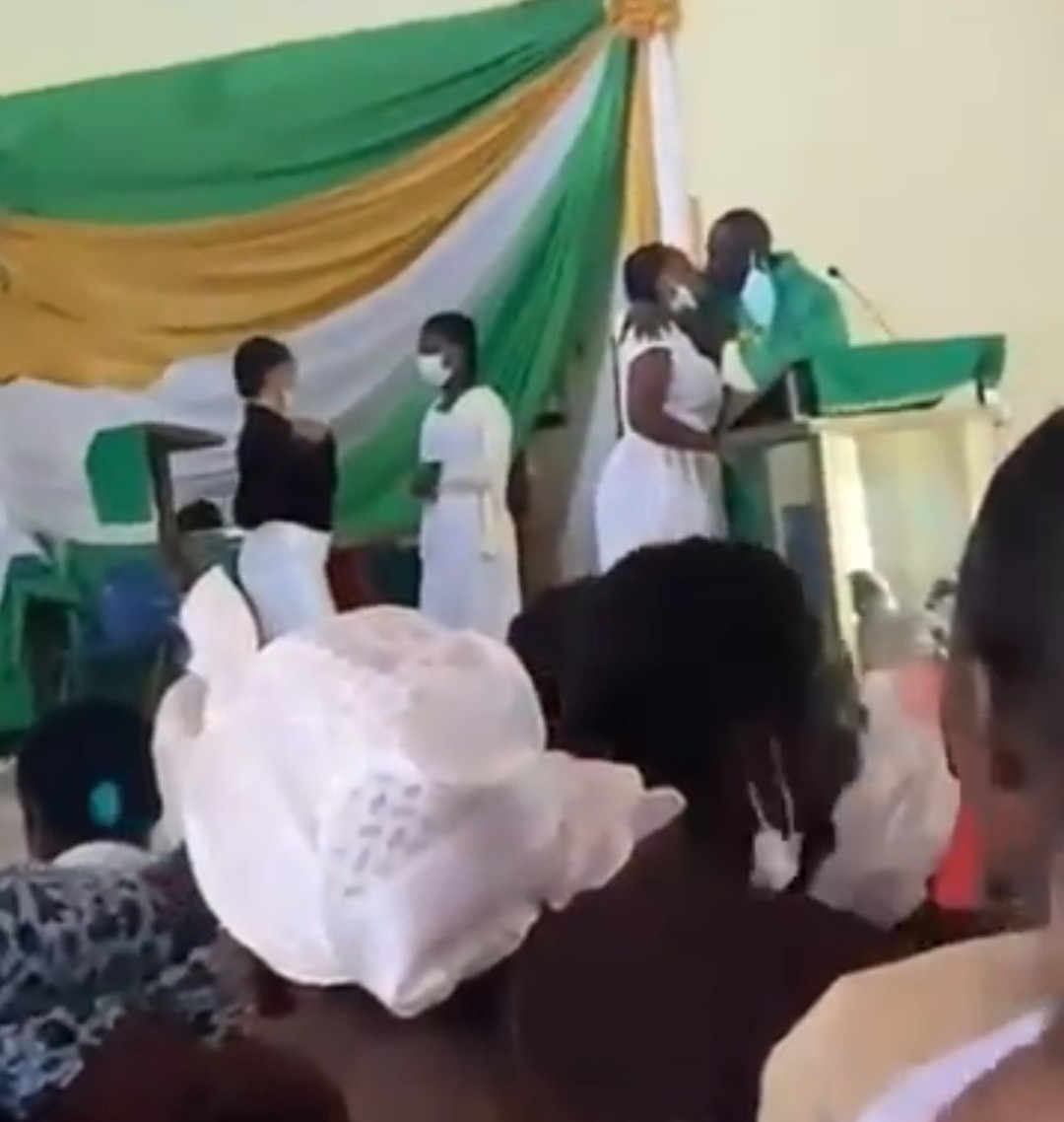Priest filmed kissing female students on the mouth inside the church (video)