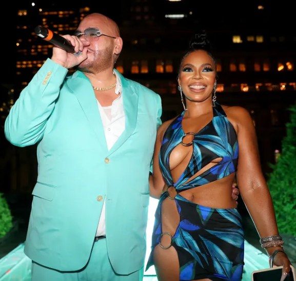Ashanti leaves little to the imagination as she steps out in a revealing dress
