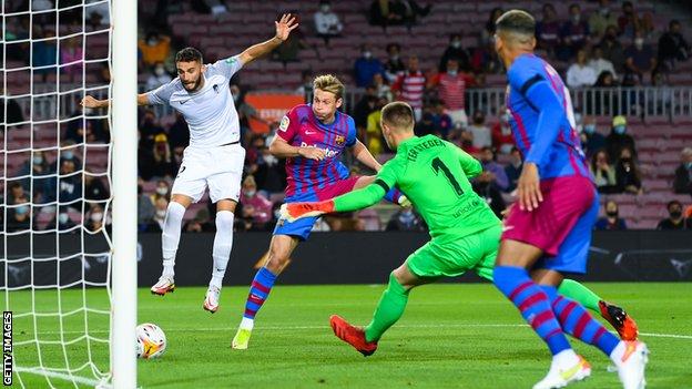 Domingos Duarte heads in for Granada at Barcelona