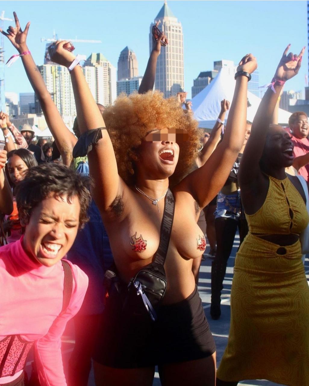 Topless woman with hairy armpit steals the show at Afropunk ATL 2021