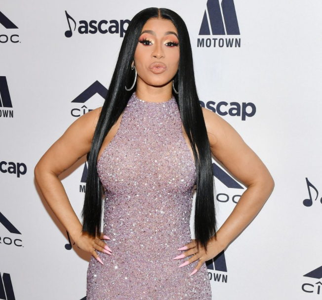 Cardi B reacts after she