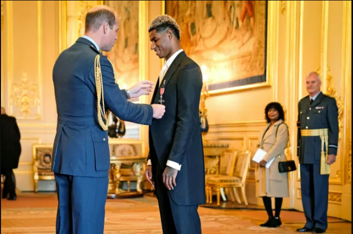 Marcus Rashford takes mum to watch him receive MBE from Prince William after free school-meals campaign (photos)