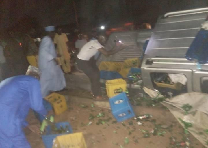 Driver injured as truck conveying alcohol falls into ditch near Hisbah office in Kano (photos)