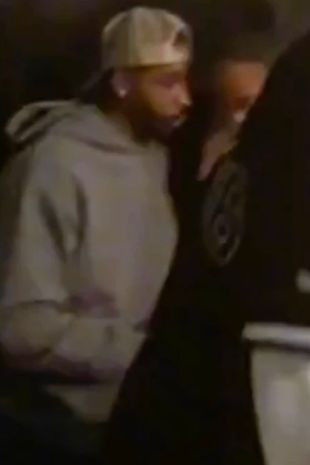 Tristan Thompson spotted getting cozy with a mystery woman weeks after he publicly apologized to Khloe Kardashian for welcoming a child with a personal trainer while they were dating (video)