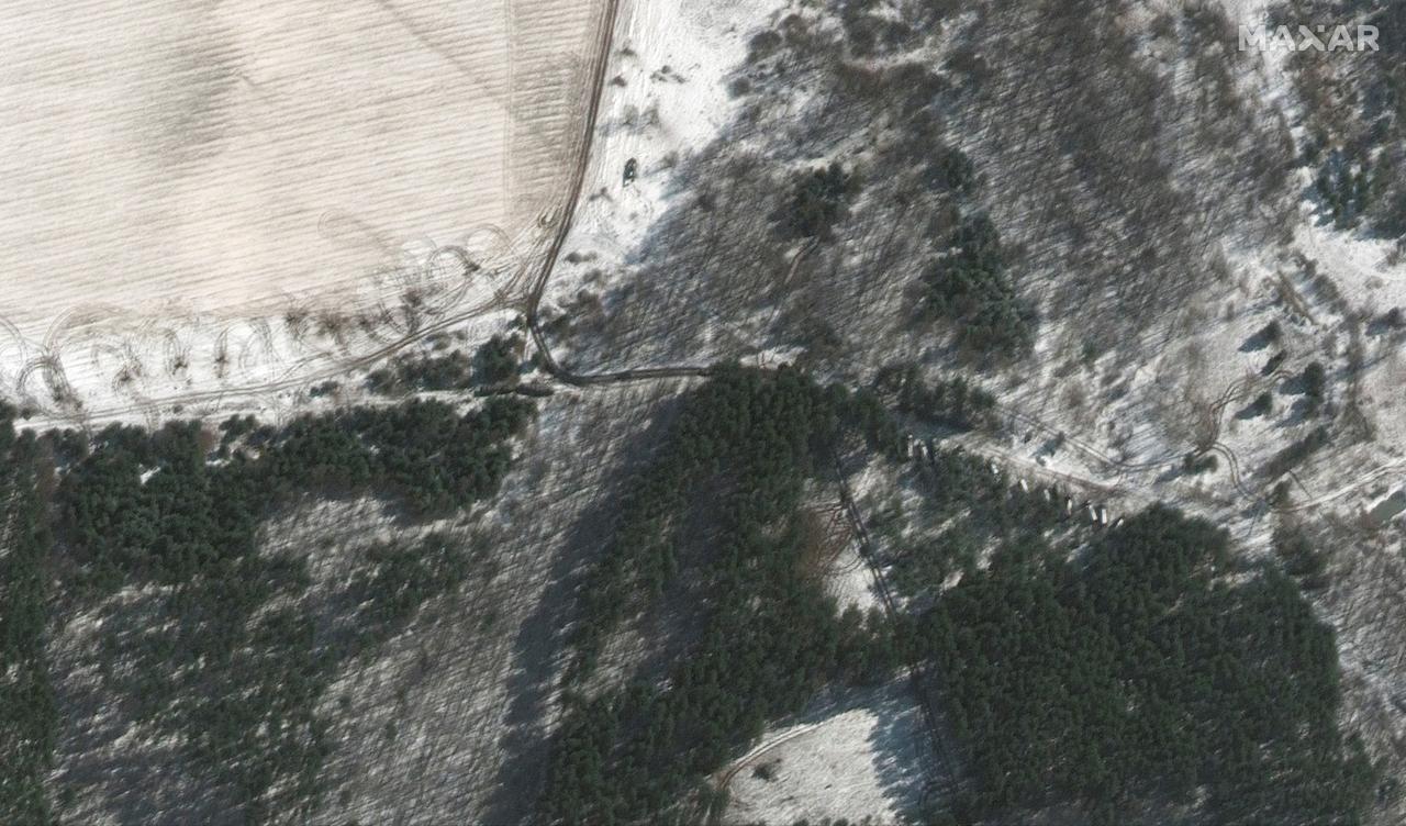 A satellite image shows troops and equipment deployed in trees, in Lubyanka at the northwest of Antonov airport, amid Russia's invasion of Ukraine, Ukraine, March 10, 2022.