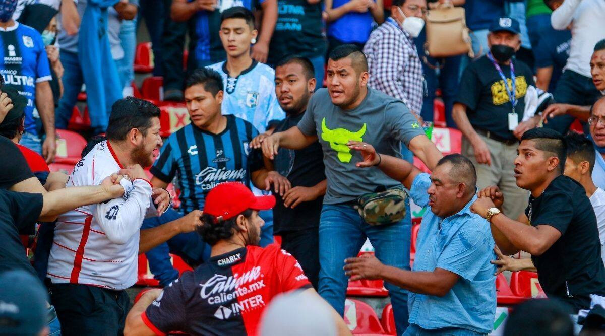 "17 reported dead" and 22 injured in brawl between rival fans at Mexican football match