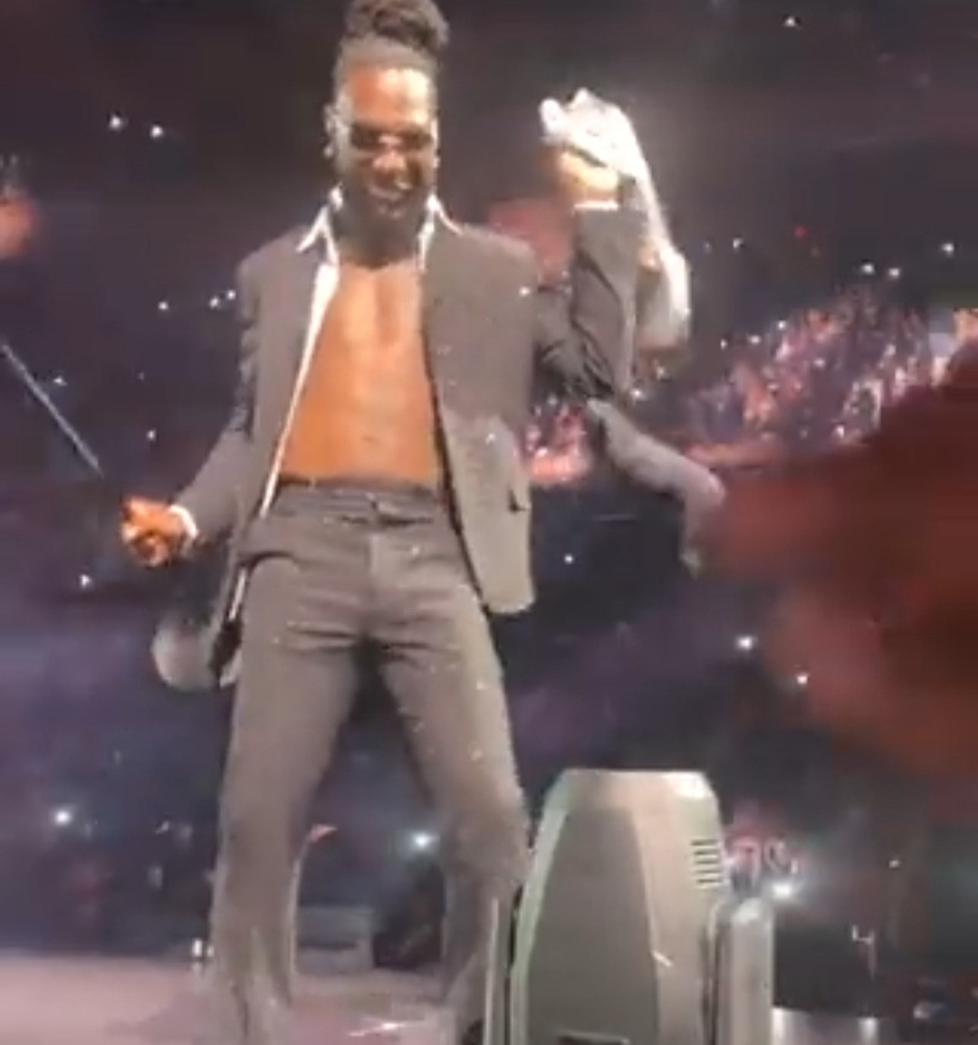 Burna Boy catches a bra as multiple women throw their underwears at him during his performance on stage (video)