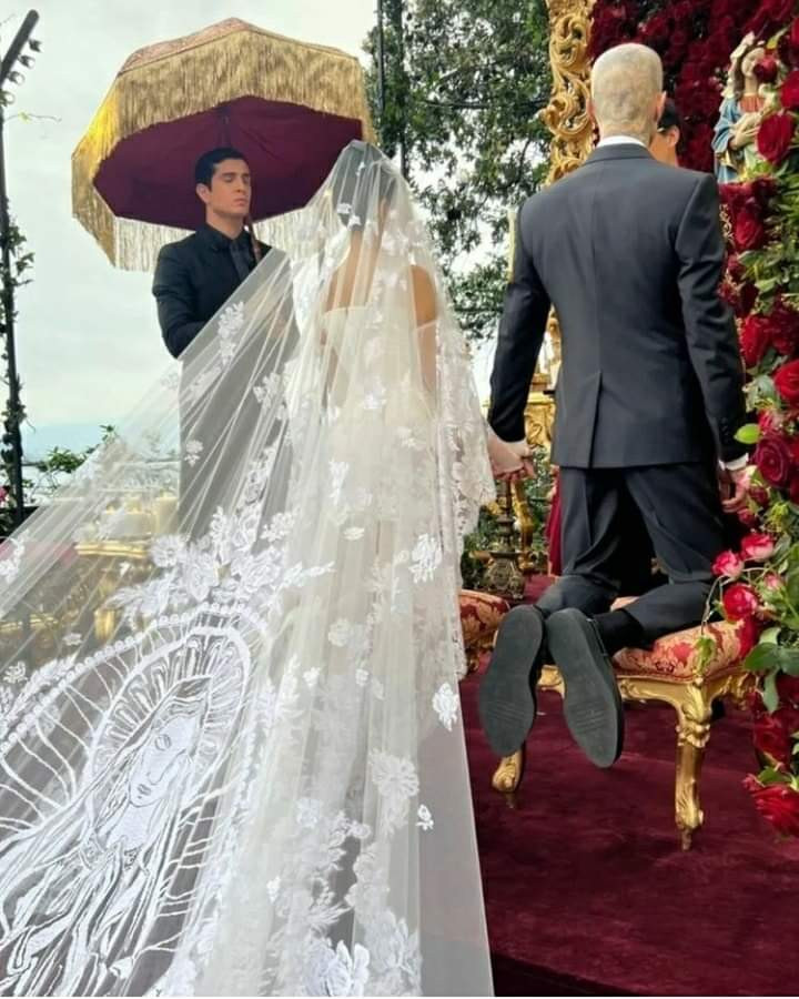 Kourtney Kardashian stuns in a mini dress and a veil with an embroidery of the Virgin Mary as she marries Travis Barker again